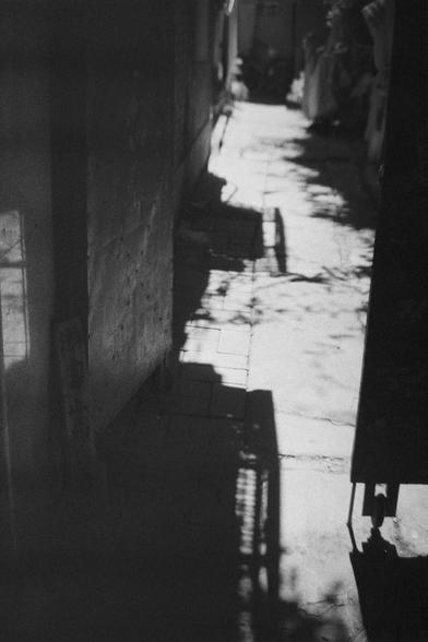 Ilford HP5 Plus 400 (FF)

English Alt Text: A narrow alleyway paved with rectangular tiles is bathed in sunlight, casting dramatic shadows across the ground. The black-and-white photograph emphasizes the contrast between light and dark. Shadows of railings and foliage create intricate patterns. The alley is flanked by walls and structures, leading the viewer’s eye into the distance. The composition evokes a quiet, contemplative mood, highlighting textures and geometry through light play.

中文替代文…