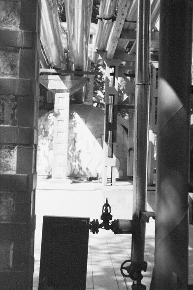 Ilford HP5 Plus 400 (FF)

English Alt Text: An outdoor industrial scene with large metal pipes running horizontally and vertically, supported by brackets and frames. A valve with a wheel handle is visible in the foreground. Concrete or brick pillars and a dome-shaped structure appear in the background. Shadows cast by the pipes suggest daylight. The image showcases mechanical complexity and engineering design in a utility or processing facility.

中文替代文字：
这是一幅室外工业场景图像，画面中有多根大型金属管道横向与纵向交错，由支架和框架支…