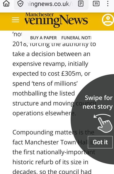 Manchester Evening News online article partly obscured by a black semicircle prompt to scroll to the next article.
