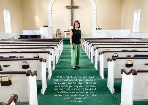 A woman standing in a church. 