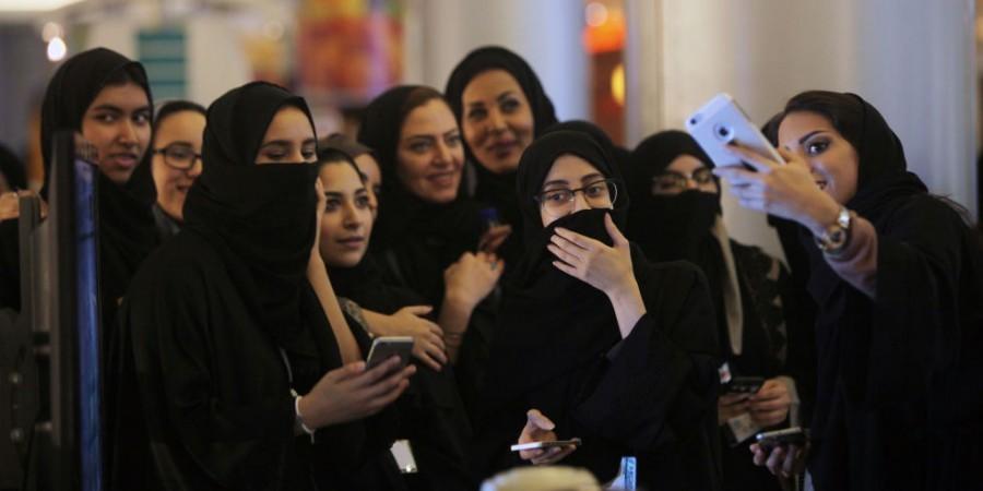 A group of women taking selfies after voting.