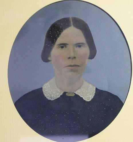 Photograph of an old photo of my paternal great-grandmother. 