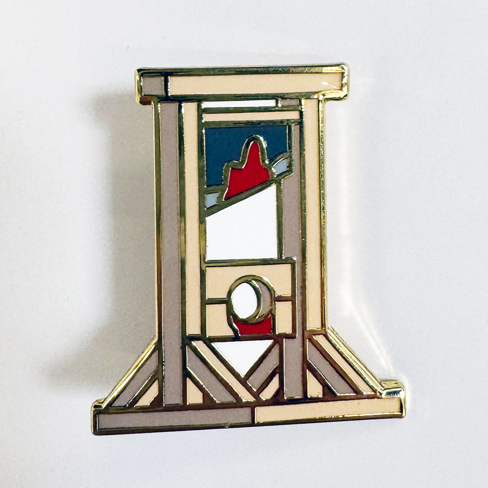 A pin of a guillotine with blood on it.
