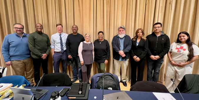 A group of people standing.