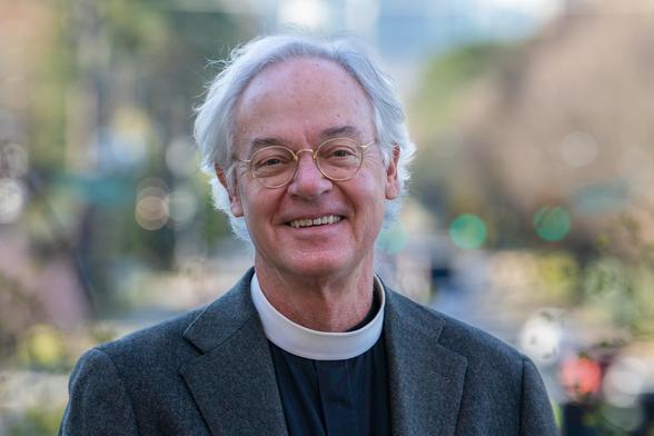 A man in a clerical collar.
