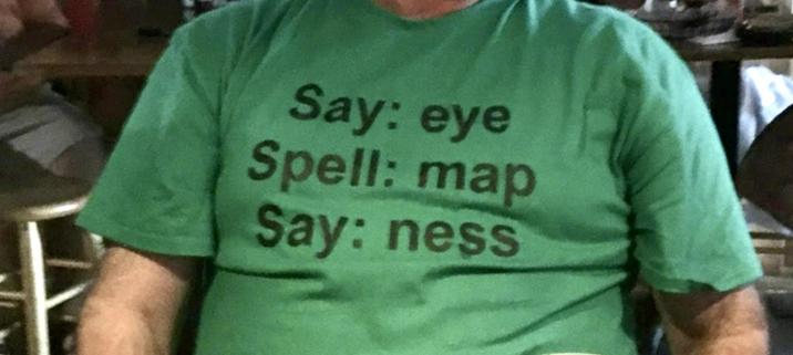 Image of a t-shirt with text on front.
Say: eye
Spell: map
Say: ness
