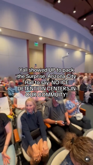 A conference room is packed with a nearly all white crowd of people opposed to a new ICE concentration camp in their community. Text reads "Y'all showed UP to pack the Surprise, Arizona City Hall to say NO ICE DETENTION CENTERS IN OUR COMMUNITY!"