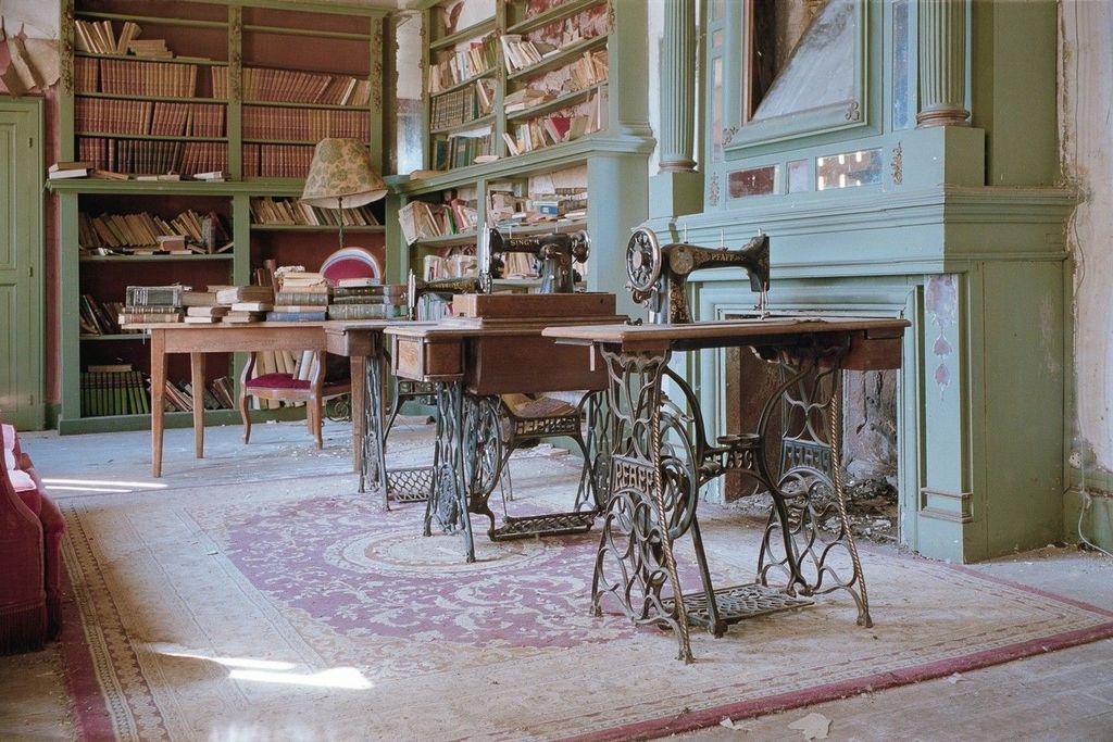 an old library, with several sewing machines on tables