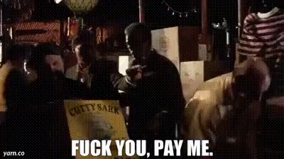 An animated GIF from the movie Goodfellas. The voiceover narration tells the viewers about the harsh nature of a business owner entering a deal with the mob. It doesn't matter what struggles you have, the attitude is "fuck you, pay me." In the scene, a suited Ray Liotta is walking through a warehouse while mobsters are walking past with boxes of whiskey, looking at clothing, etc. They're looting the place to receive their compensation.