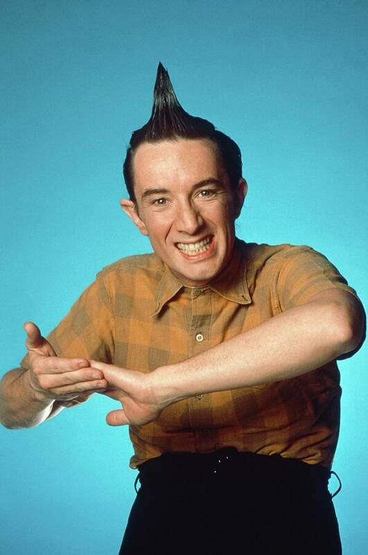 Martin Short as Ed Grimley on Saturday Night Live, with his hair moussed into a peak.