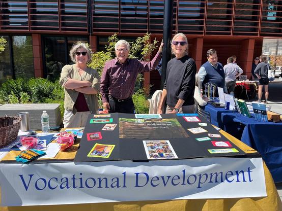 Three people at a table. 