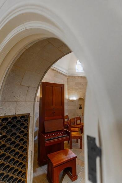 A narrow organ in a chapel.