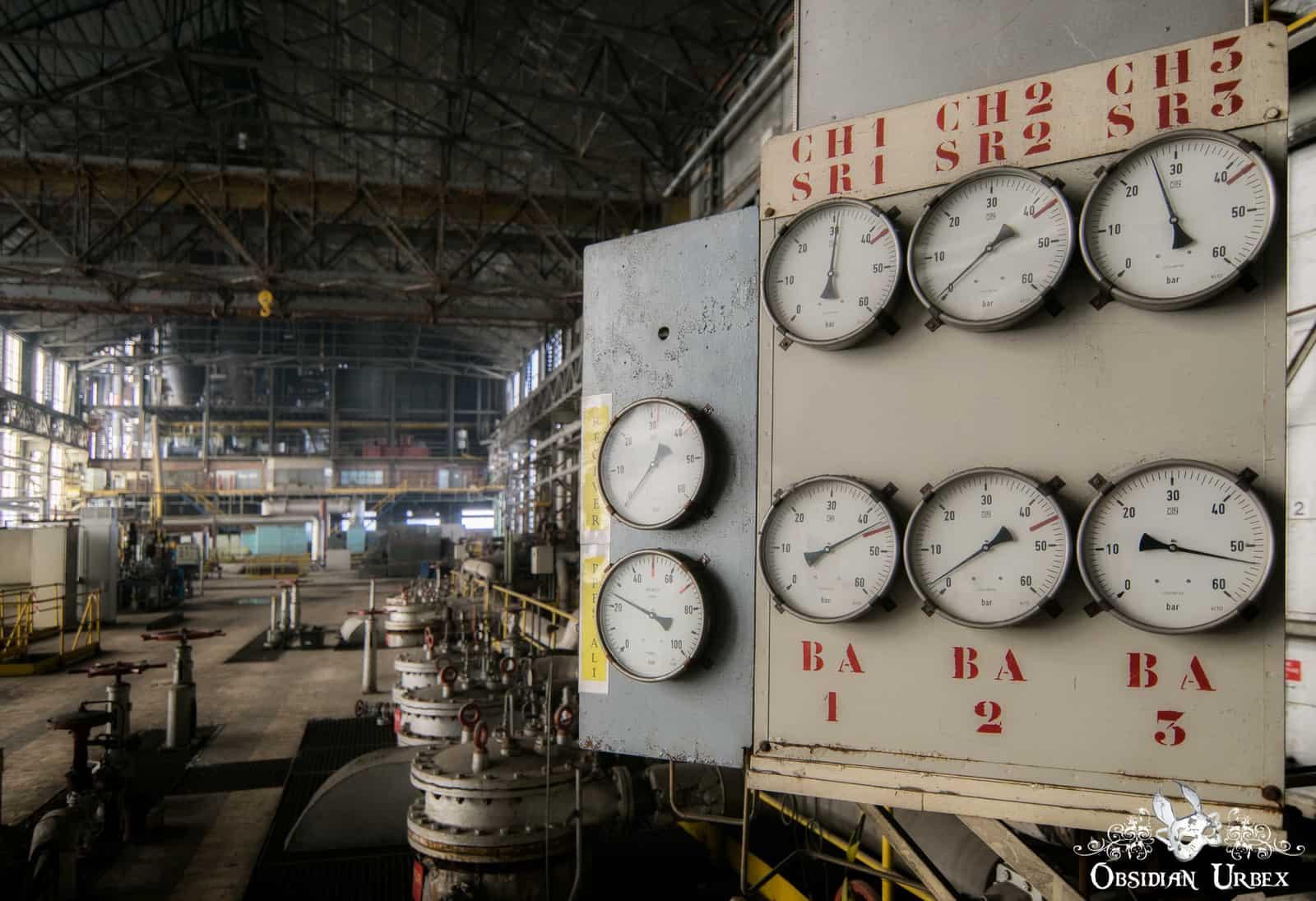 Pressure gauges on an industrial control panel from an abandoned power plant