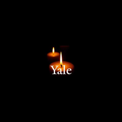 two candles with Yale overlaid text