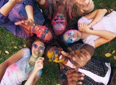 Young people in sunglasses and bright, chromatic, powder.
