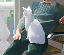 A white cat, seated on Mr. Clark's lap, faces away from the viewer as it gazes out of the open balcony door. Mr. Clark, dressed in a soft green sweater and dark green slacks, provides both a seat and a sharpening background for the white cat, whose name is Percy.