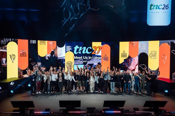 TNC26 organising team group picture on the stage