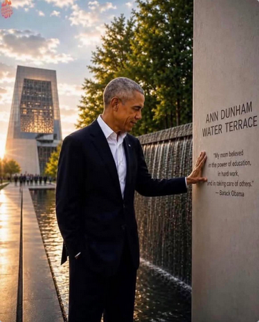 Photo by Scott Galloway of Barack Obama in a dark suit without a tie, standing outside his new presidential library at the memorial water terrace dedicated to his mother. It's a picture with a partly cloudy evening sky over the new library, large grey building, in the background. There are trees around the property, and then there's a dark stone waterfall with this message engraved in grey stone nearby: "ANN DUNHAM WATER TERRACE 'My mom believed in the power of education, in hard work, and in taking care of others.' -Barack Obama"