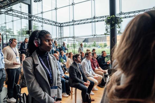 woman and other people listening to a presentation