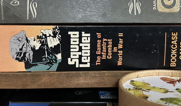 A copy of the game Squad Leader on a shelf.