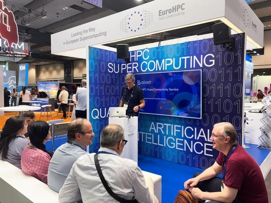 picture of a man speaking at a booth
