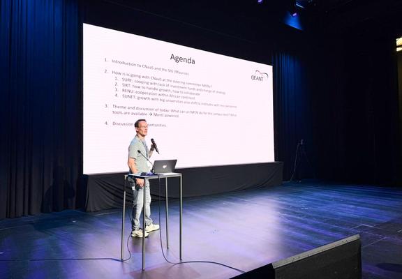 Man presenting on a stage
