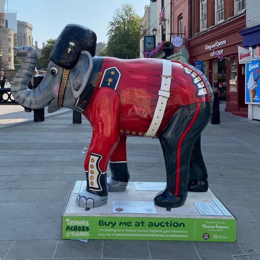 In front of Windsor Castle, a fibreglass sculpture of an elephant.

It's decorated to look as if it's wearing the uniform of the King's Guards - beefeater hat, red jacket, white belt, black trousers.