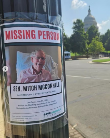 With the US Capitol in the background under a blue sky, a poster is affixed to what looks like a lamp post. "MISSING PERSON: SEN MITCH MCCONNELL 84 YEARS, 5'9", TURTLE-LIKE, LAST SEEN JUNE 11, 2026 KNOWN FOR: BLOCKING SOMETHING IN THE SENATE. DISTINGUISHING FEATURE: TORTOISE LIKE APPEARANCE." Shows the first fake proof of life photo they put out.