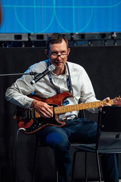 man playing a guitar