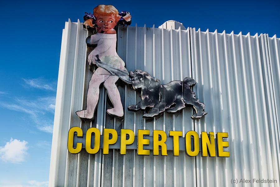 Vintage Coppertone girl sign