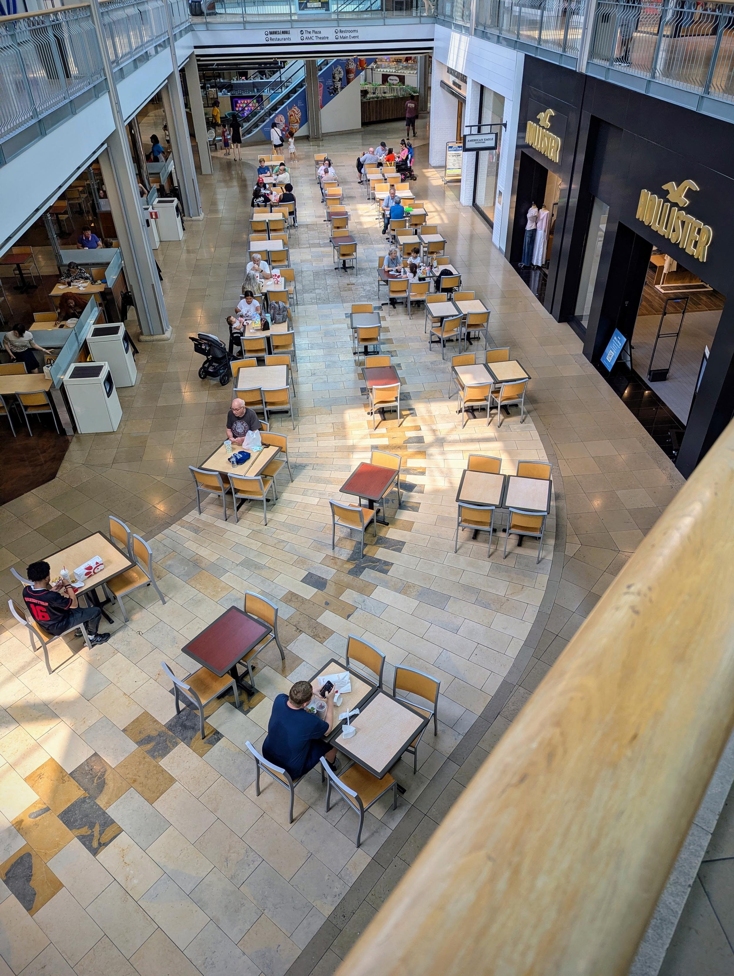 Overhead view of food court seating area.