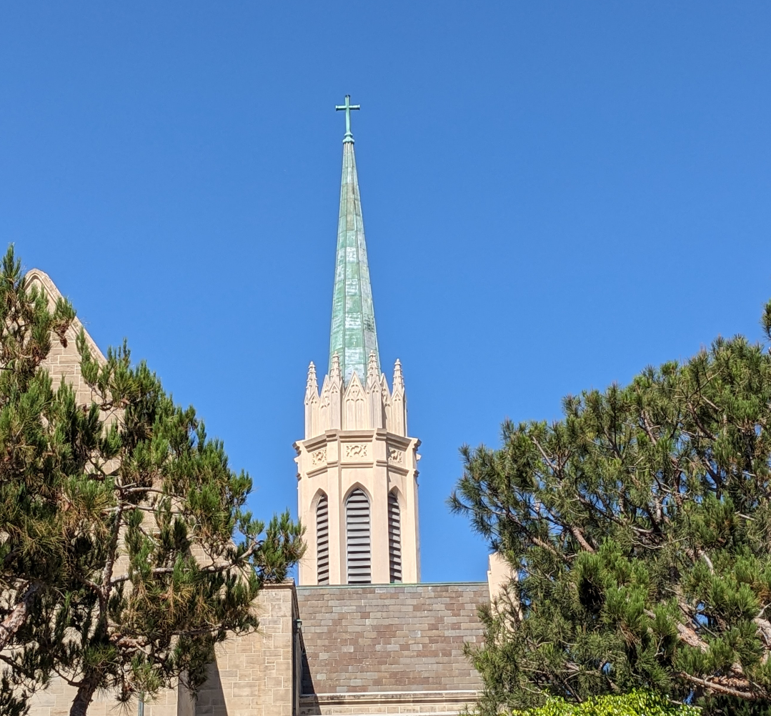 Spire with green copper roof and cross