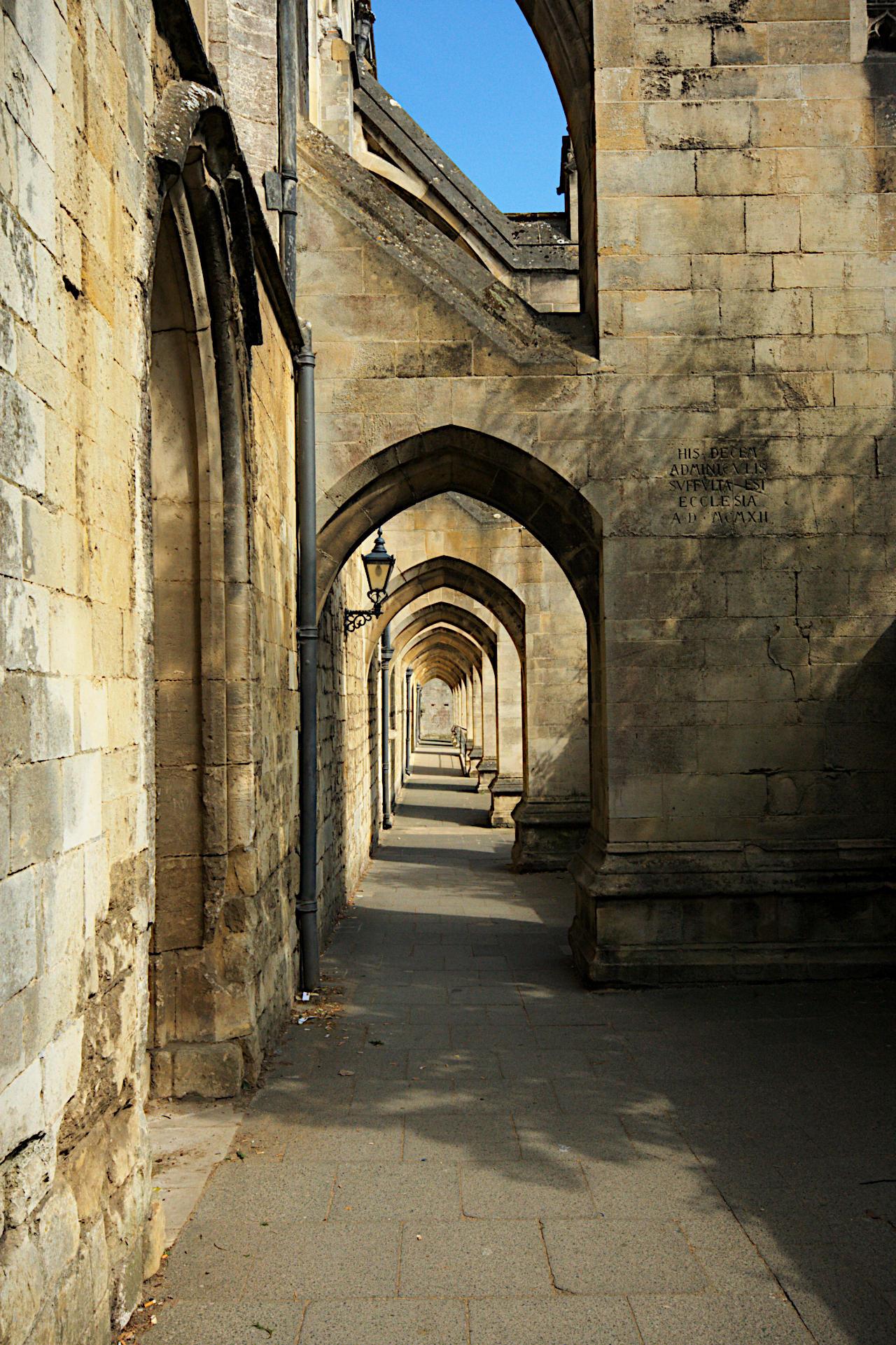 Pale gold limestone arches over a walkway formed by a series of flying buttresses along the south side of the nave of Winchester cathedral.

Canon EOS 400D DIGITAL
ISO: 400
Shutter Speed: 1/200
Aperture: 14.0

Lens: 10.0 - 20.0 mm
Focal Length: 20.0 mm (35 mm equivalent: 32.4 mm)
Hyperfocal Distance: 1.54 m
Depth Of Field: inf (1.53 m - inf)
Field Of View: 58.2 deg

GPS Position: 51 deg 03' 38.7" N, 1 deg 18' 50.9" W
Winchester, Hampshire, England, United Kingdom

2011:05:02 14:33:02
Copyright: © Matthew Malthouse 2011