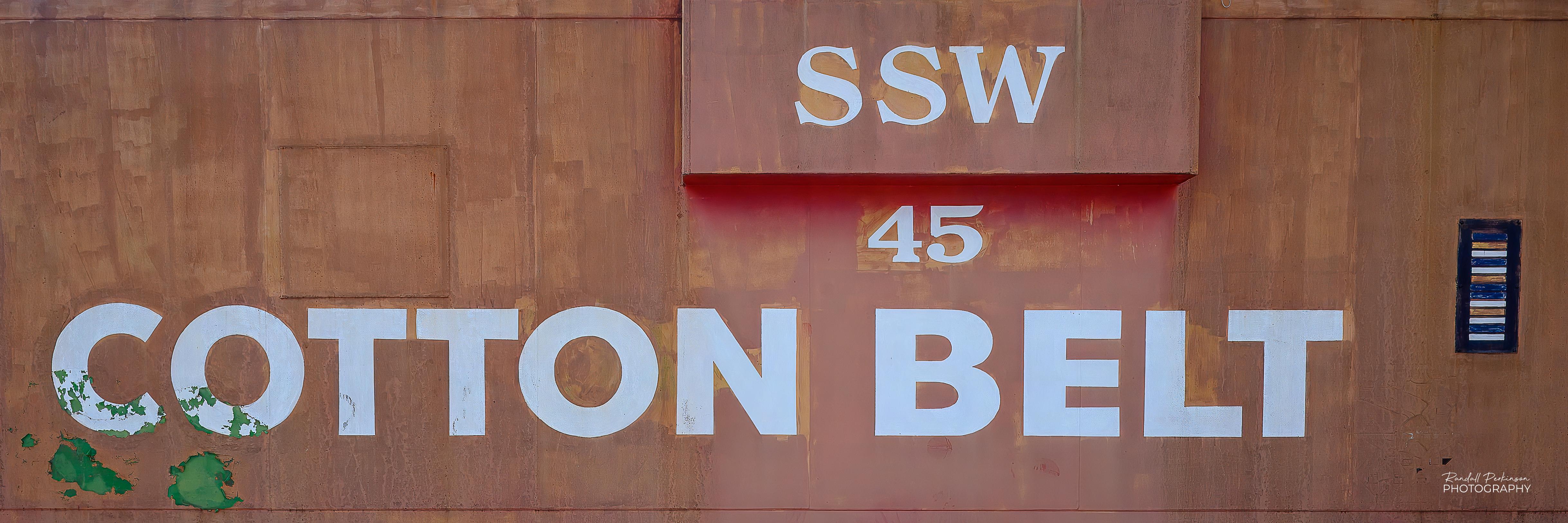 The side of an old caboose "SSW", "45", and "COTTON BELT" written on the side.
