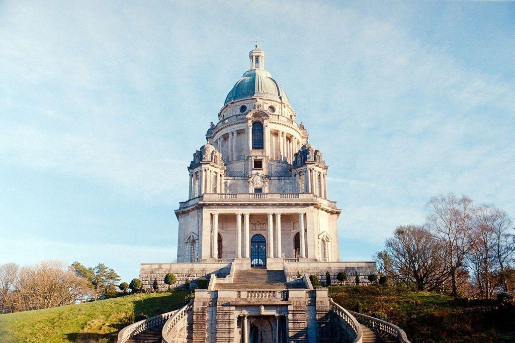 old building with domes roof, stairs lead upwards to it
