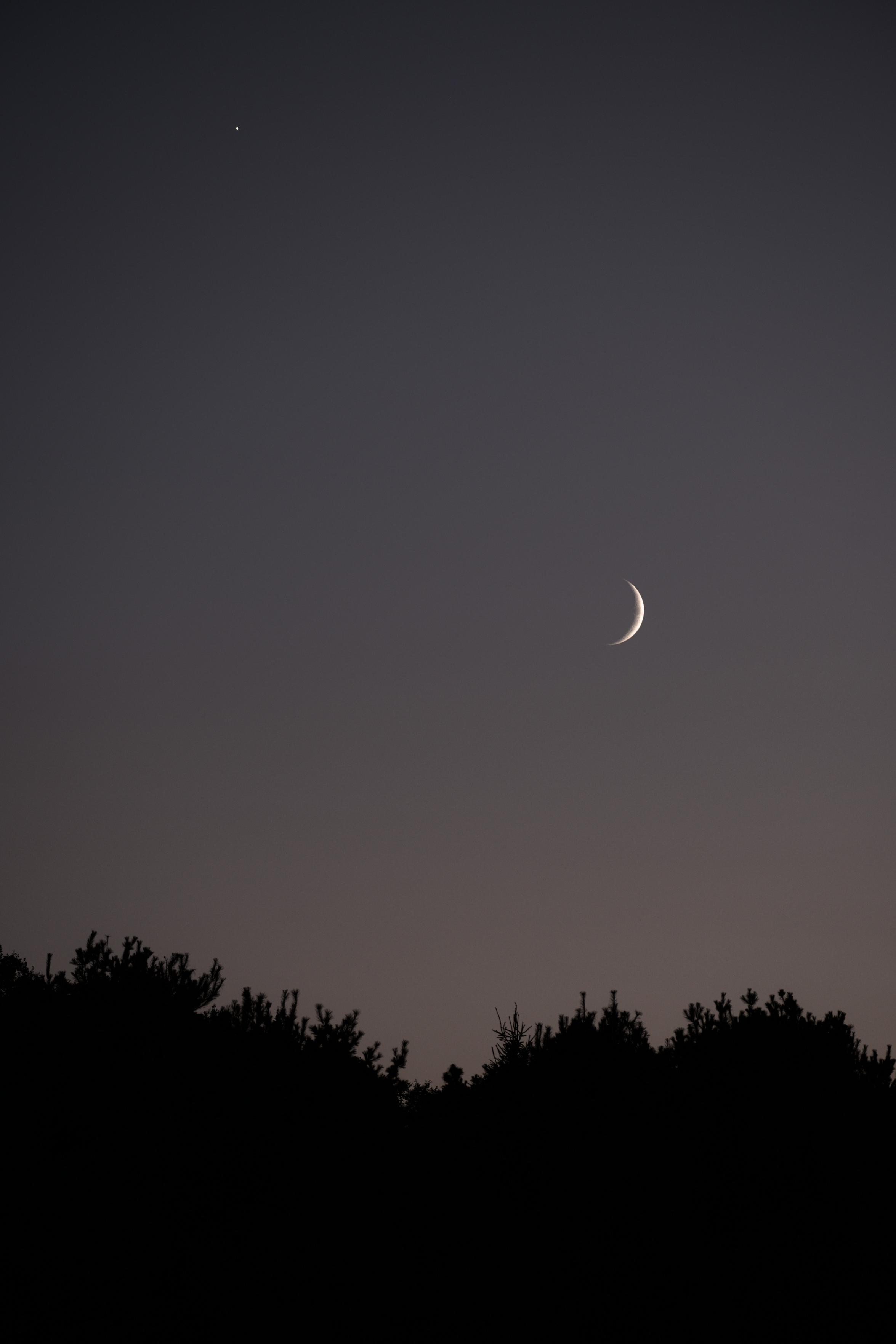 A setting sliver of a moon.