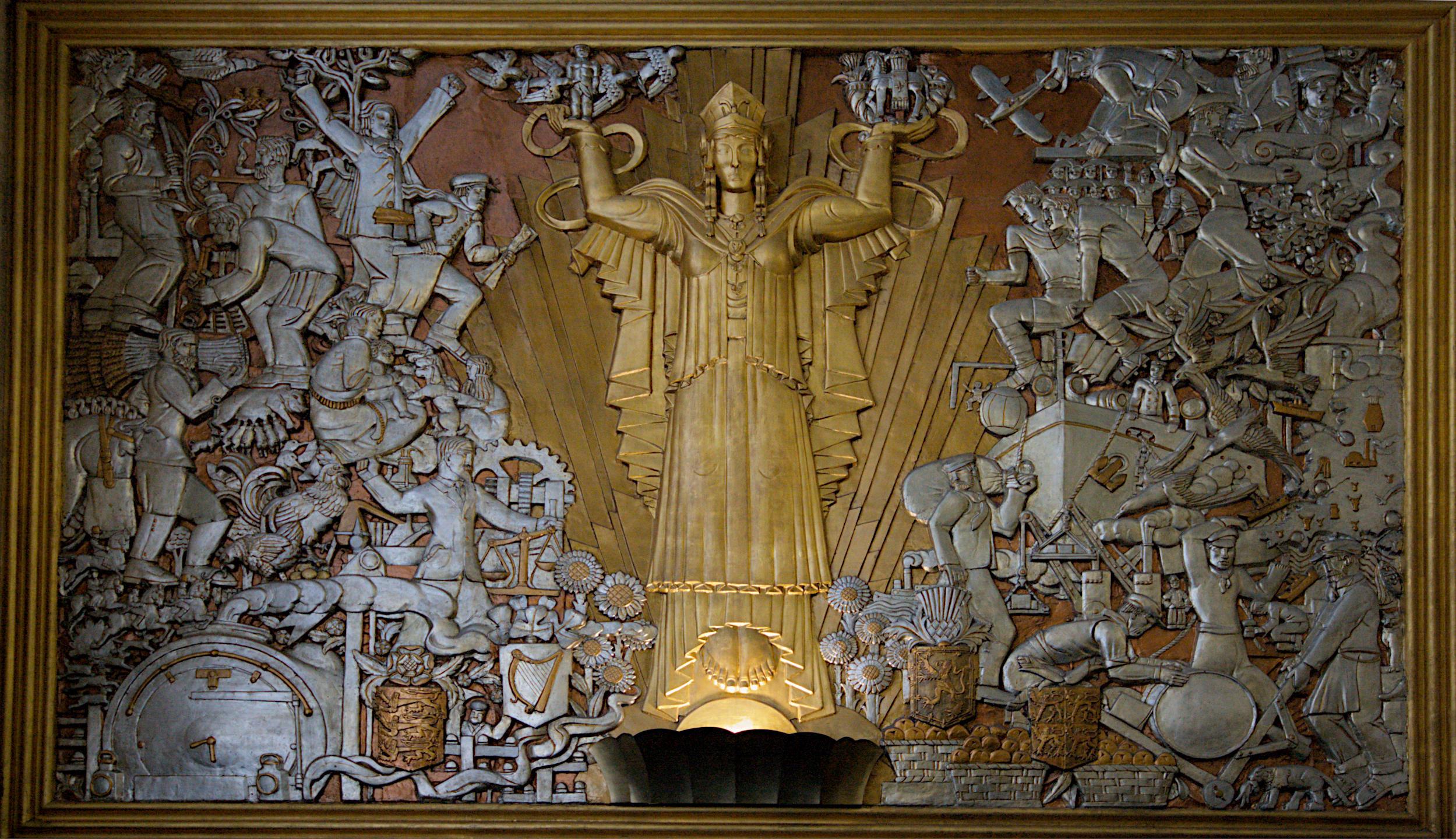 Art Deco relief panel "Britain" located in the foyer of the former Daily Express Building on Fleet Street, London. It was sculpted by Eric Aumonier around 1932, depicting a central female figure representing Britain flanked by scenes of industry and progress.

Canon EOS 400D DIGITAL
ISO: 800
Shutter Speed: 1/40
Aperture: 6.3

Lens: 10.0 - 20.0 mm
Focal Length: 20.0 mm (35 mm equivalent: 32.4 mm)
Hyperfocal Distance: 3.42 m
Depth Of Field: inf (1.98 m - inf)
Field Of View: 58.2 deg

GPS Position: 51 deg 30' 51.80" N, 0 deg 6' 21.60" E

2007:09:15 13:04:17
Copyright: Copyright © Matthew Malthouse 2007
