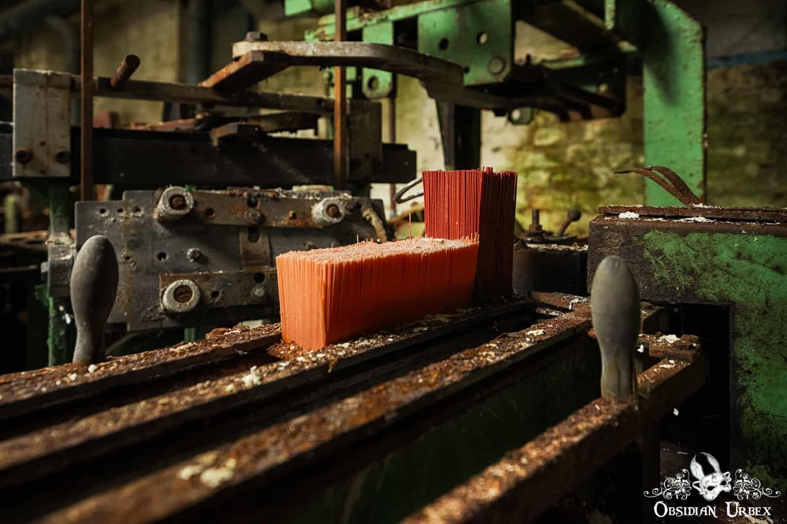 close up of broom making machine