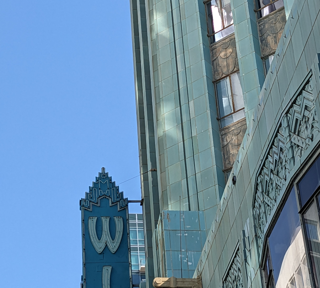 Top of the Wiltern sign and reflected light on the building