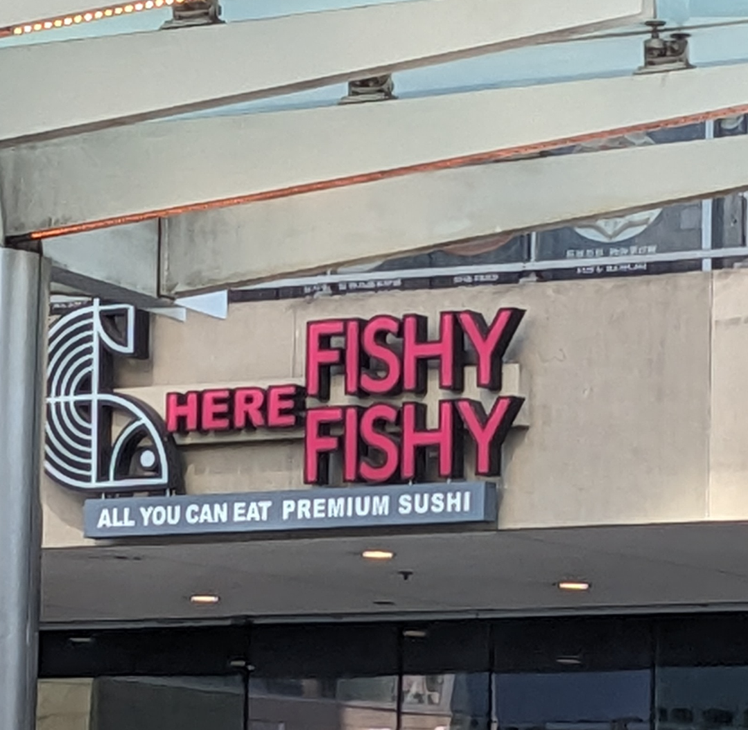 Sign for a sushi joint says Here Fishy Fishy