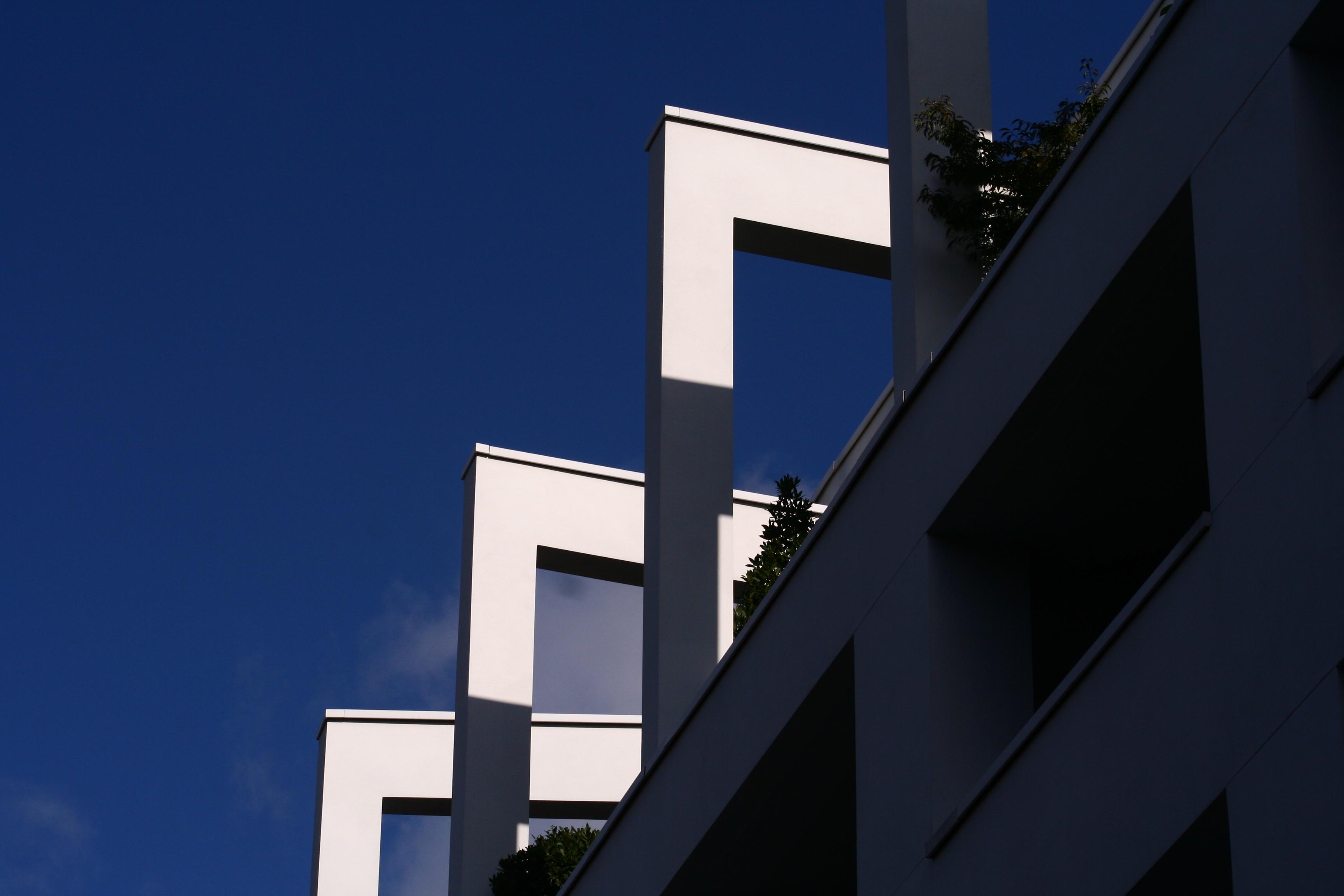 Square column and beam supports to the upper storey of a 1938 light industrial building rendered in white stucco. The lower parts of the columns are in shadow, the upper part in bright sunlight against an almost clear blue sky giving a geometrical effect of three repeated sharp right angles.


Canon EOS 350D DIGITAL
ISO: 200
Shutter Speed: 1/800
Aperture: 11.0

Lens: 75.0 - 300.0 mm
Focal Length: 80.0 mm (35 mm equivalent: 129.8 mm)
Hyperfocal Distance: 31.41 m
Field Of View: 15.8 deg

GPS Position: 51 deg 31' 23.0" N, 0 deg 06' 34.2" W
Warner House, 43/49 Warner St, London EC1R 5ER

2005:08:25 09:03:54
Copyright: © Matthew Malthouse 2005