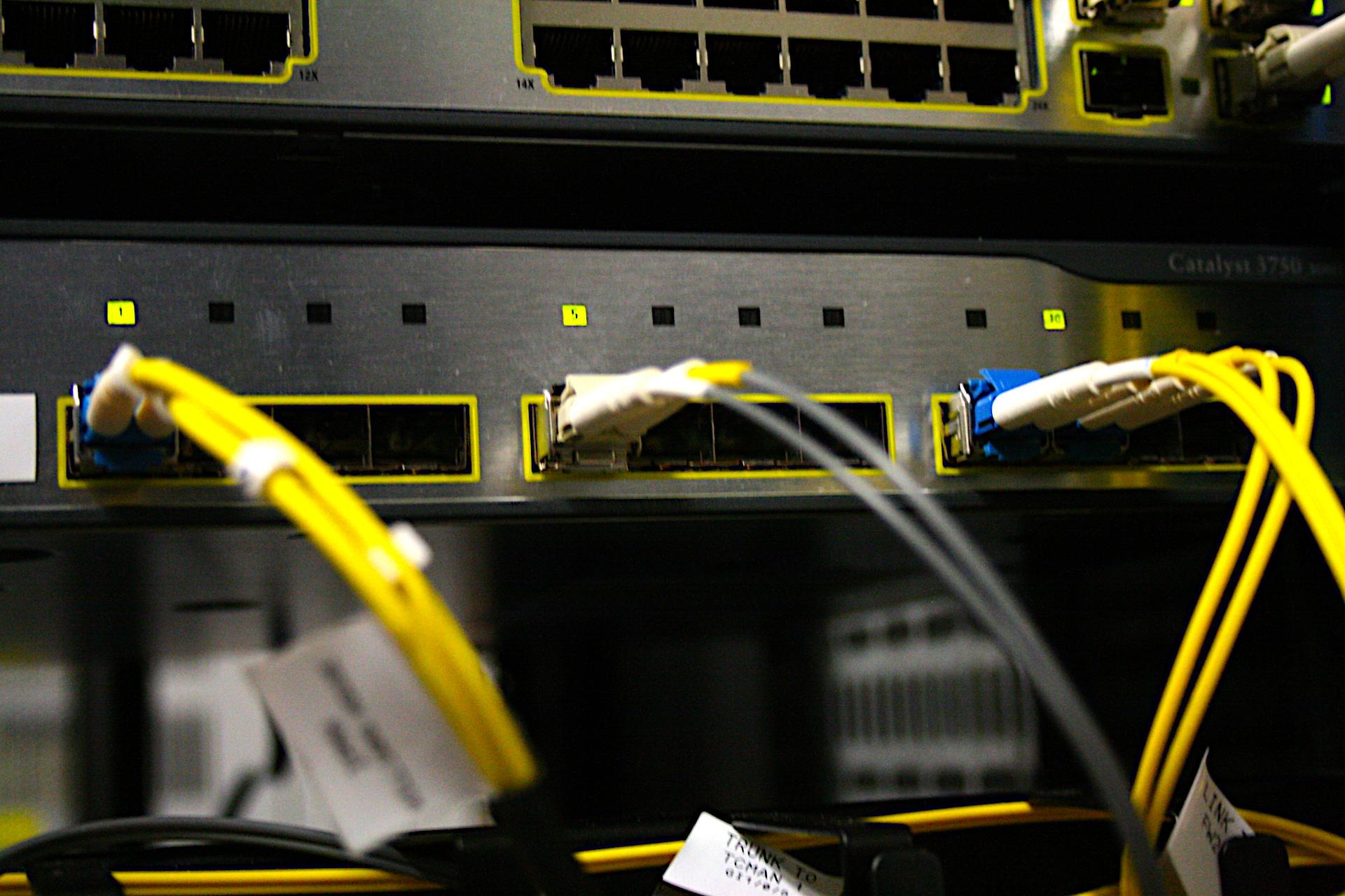 Close up of bright yellow fibre optic cables with white shrouds plugged into ports of a network switch

Canon EOS 400D DIGITAL
ISO: 1600
Shutter Speed: 1/20
Aperture: 5.0

Lens: 18.0 - 55.0 mm
Focal Length: 38.0 mm (35 mm equivalent: 61.5 mm)
Hyperfocal Distance: 15.56 m
Depth Of Field: 0.019 m (0.396 - 0.415 m)
Field Of View: 32.6 deg

2008:08:19 12:18:16
© Matthew Malthouse 2008