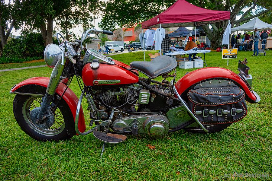 Early 1950s red Harley Davidson with leather saddles
