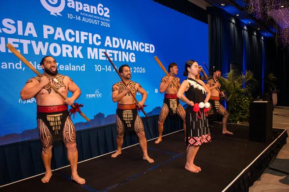 group of men and women performing haka