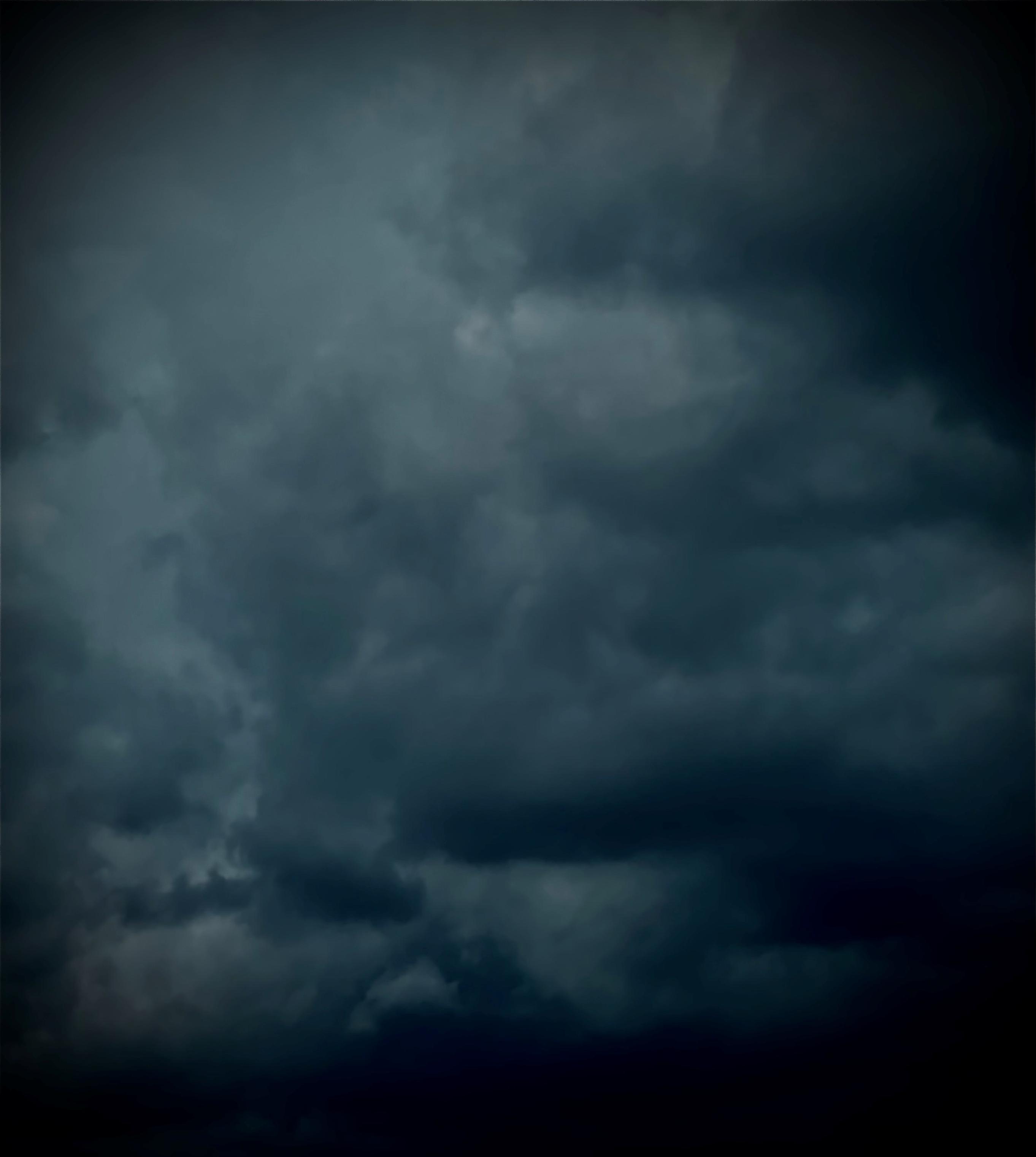 Color image of dark gray rain clouds in the sky over Akron, Summit County, Ohio, USA 27 August 2026. Image shows heavy cumulus rain clouds in a dark sky.