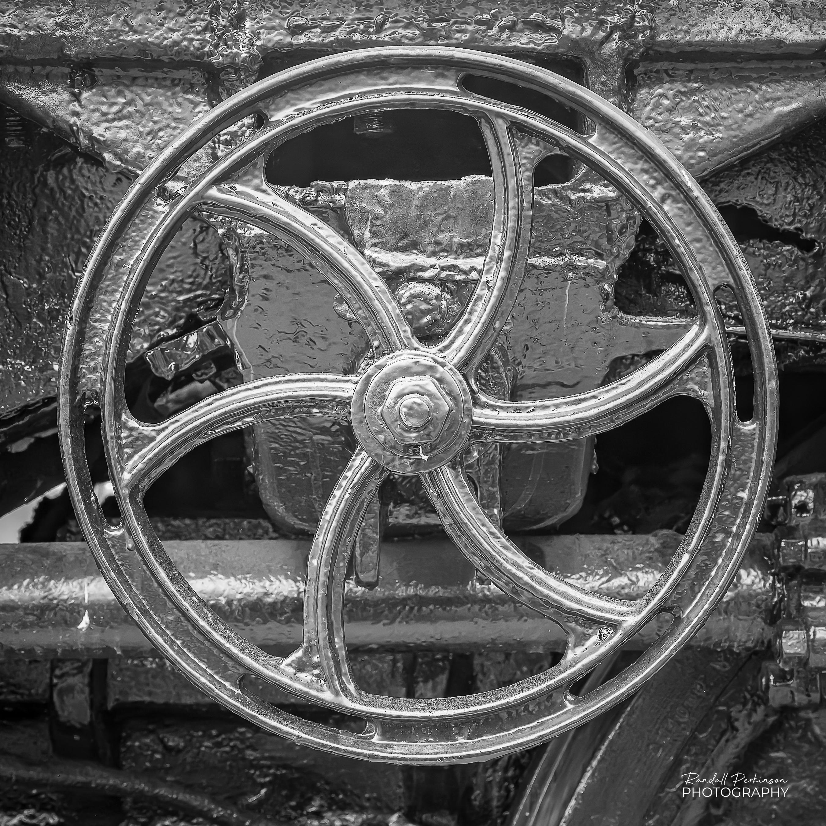 A cast iron valve handwheel on Union Pacific "Big Boy" 4006.  It has six curved spokes that help keep it from breaking apart during large temperature fluctuations.