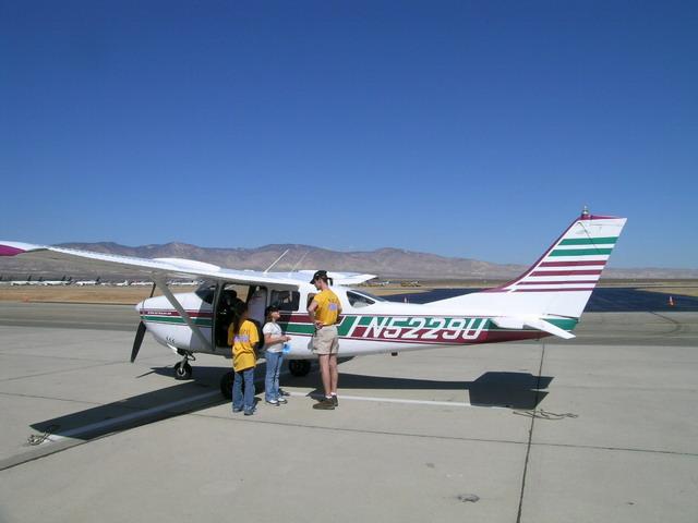 Me and my Girlfriend's daughter and her little buddy on the tarmac with a Cessna 172 I was loaned by the awesome guy Chris that owned it.