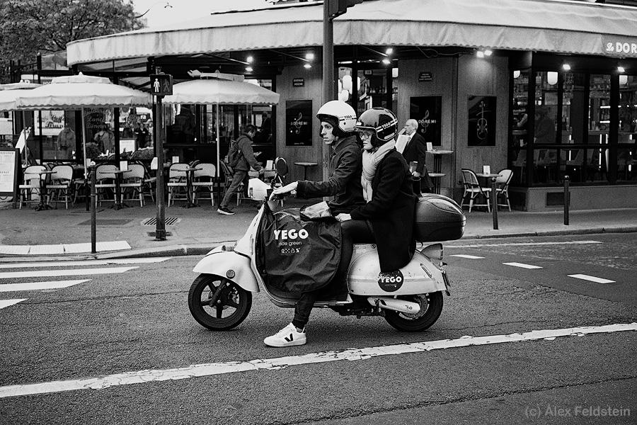 Two young people on a moped in Paris