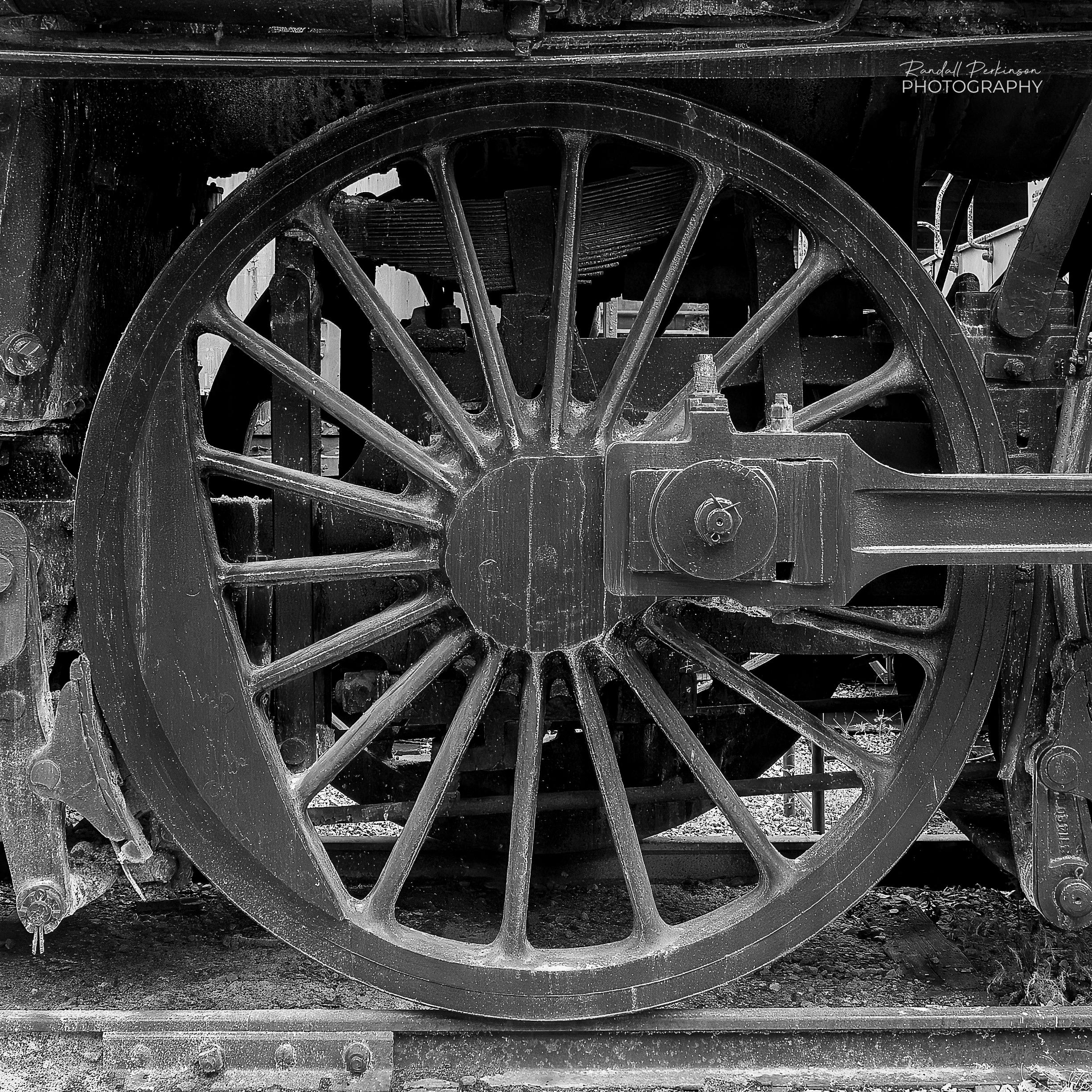 Photo of a single large locomotive drive wheel.