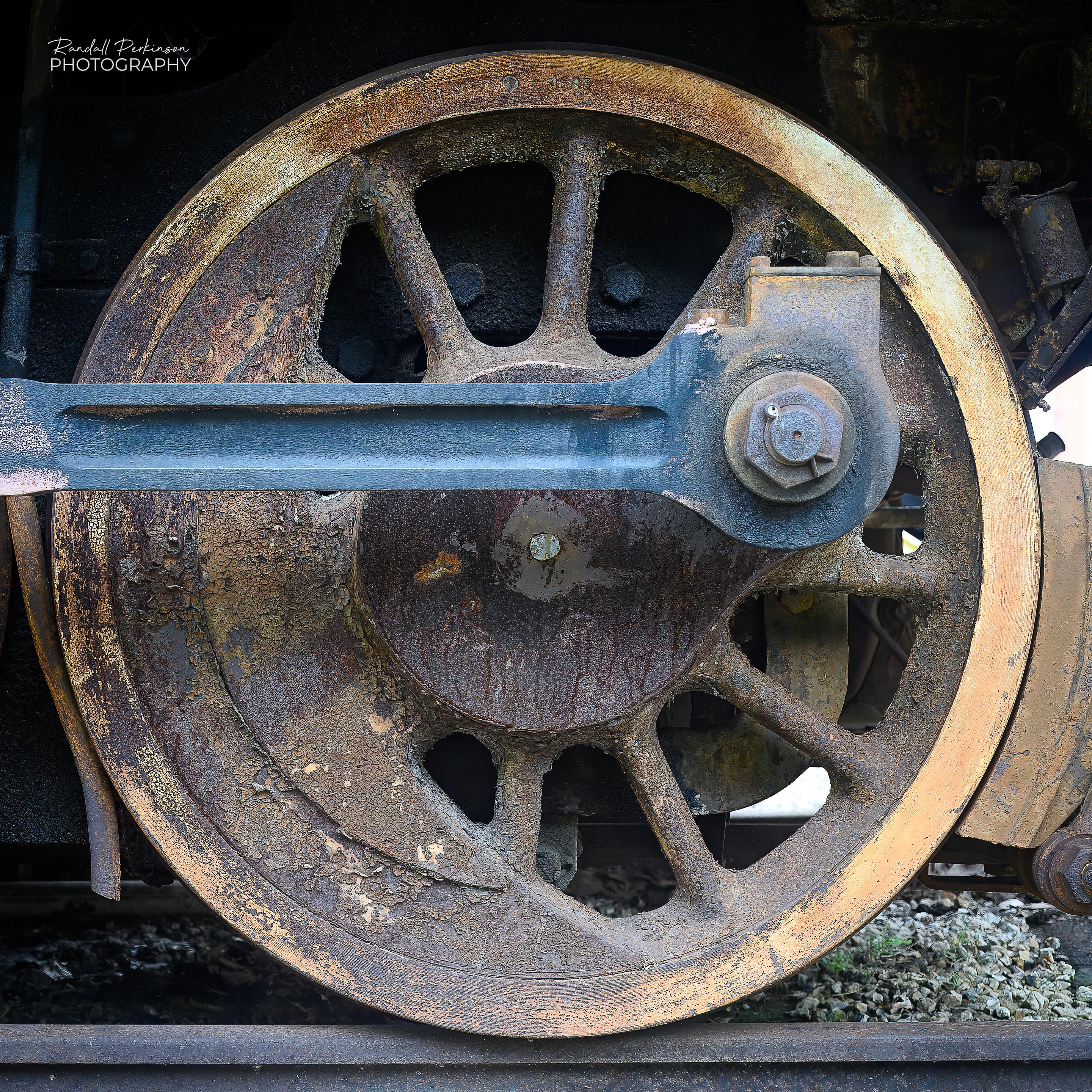 Photo of a single large locomotive drive wheel.